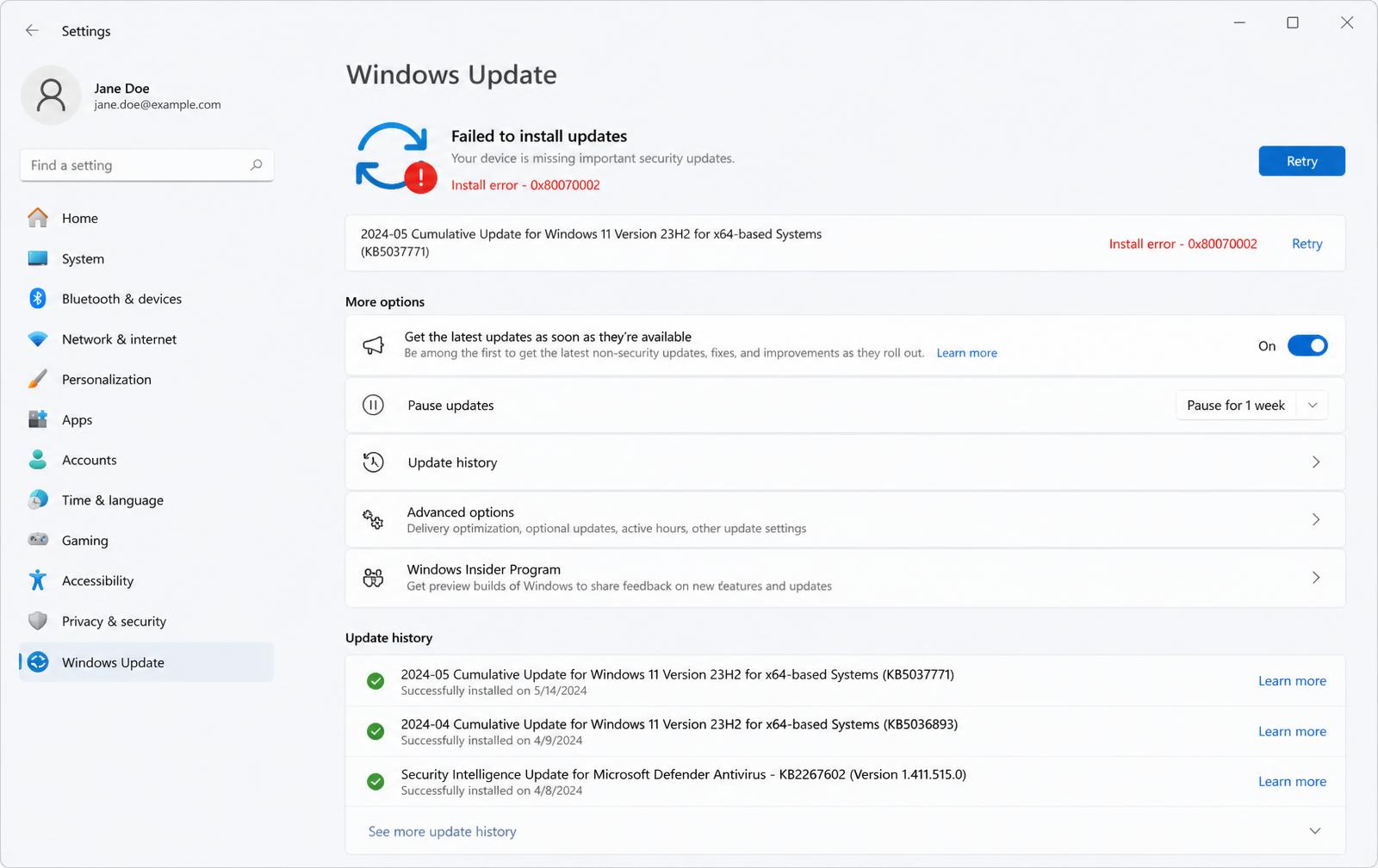 Windows Update page in Settings showing a failed install with an error code and a Retry button.
